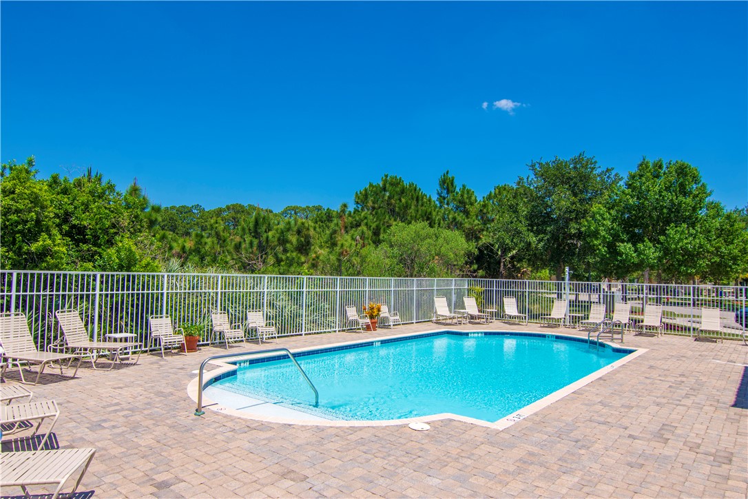 2541 Stockbridge Square Southwest Vero Beach, FL 32962 - Photo 29 of 33 a view of a swimming pool with a patio
