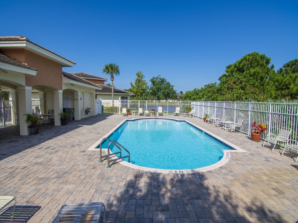 2541 Stockbridge Square Southwest Vero Beach, FL 32962 - Photo 31 of 33 a view of a swimming pool with a patio