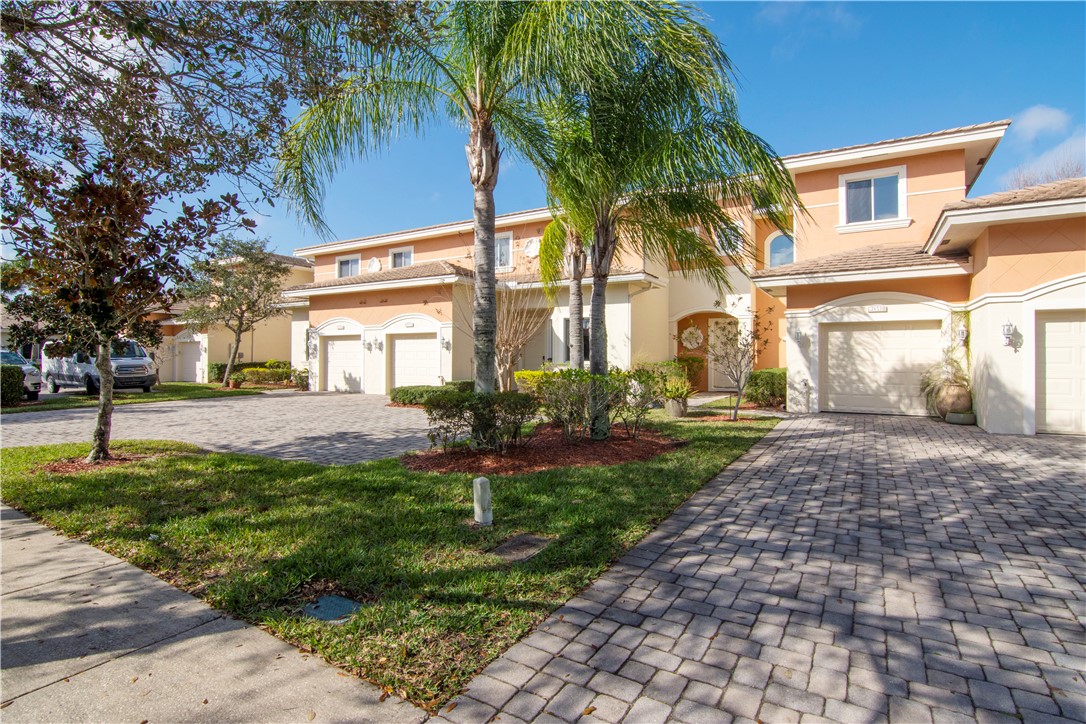 2541 Stockbridge Square Southwest Vero Beach, FL 32962 - Photo 6 of 33 a front view of a house with garden