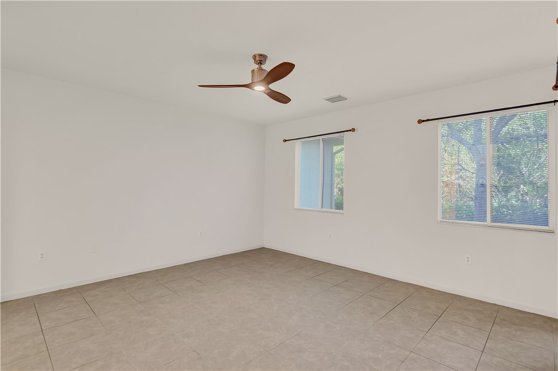 2541 Stockbridge Square Southwest Vero Beach, FL 32962 - Photo 8 of 33 an empty room with windows
