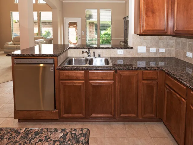 a room with a dresser and a window