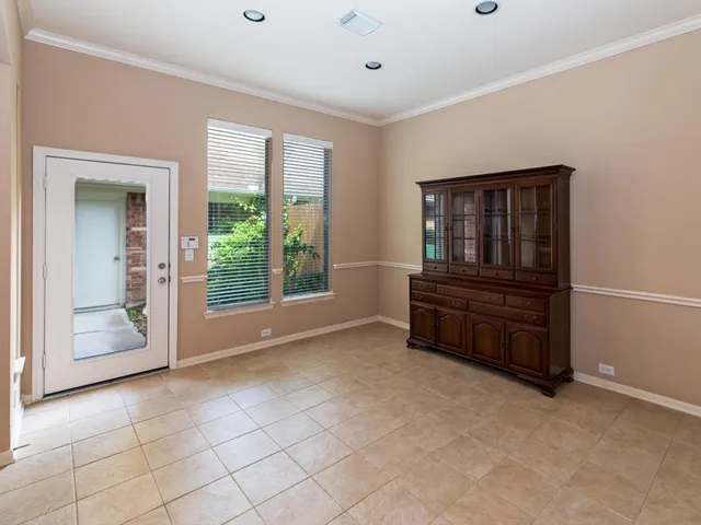 a living room with furniture and a ceiling fan