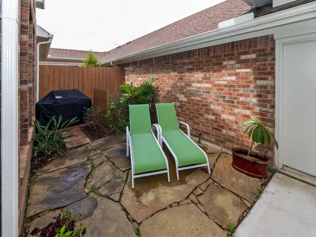 front view of a house with a garden