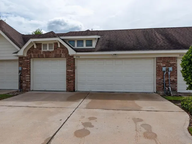 a view of a park with large trees