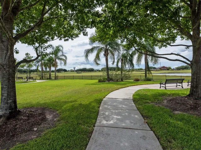 a view of a park with a big yard and a garden