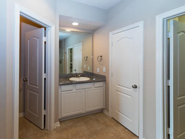 a bathroom that has a glass shower door