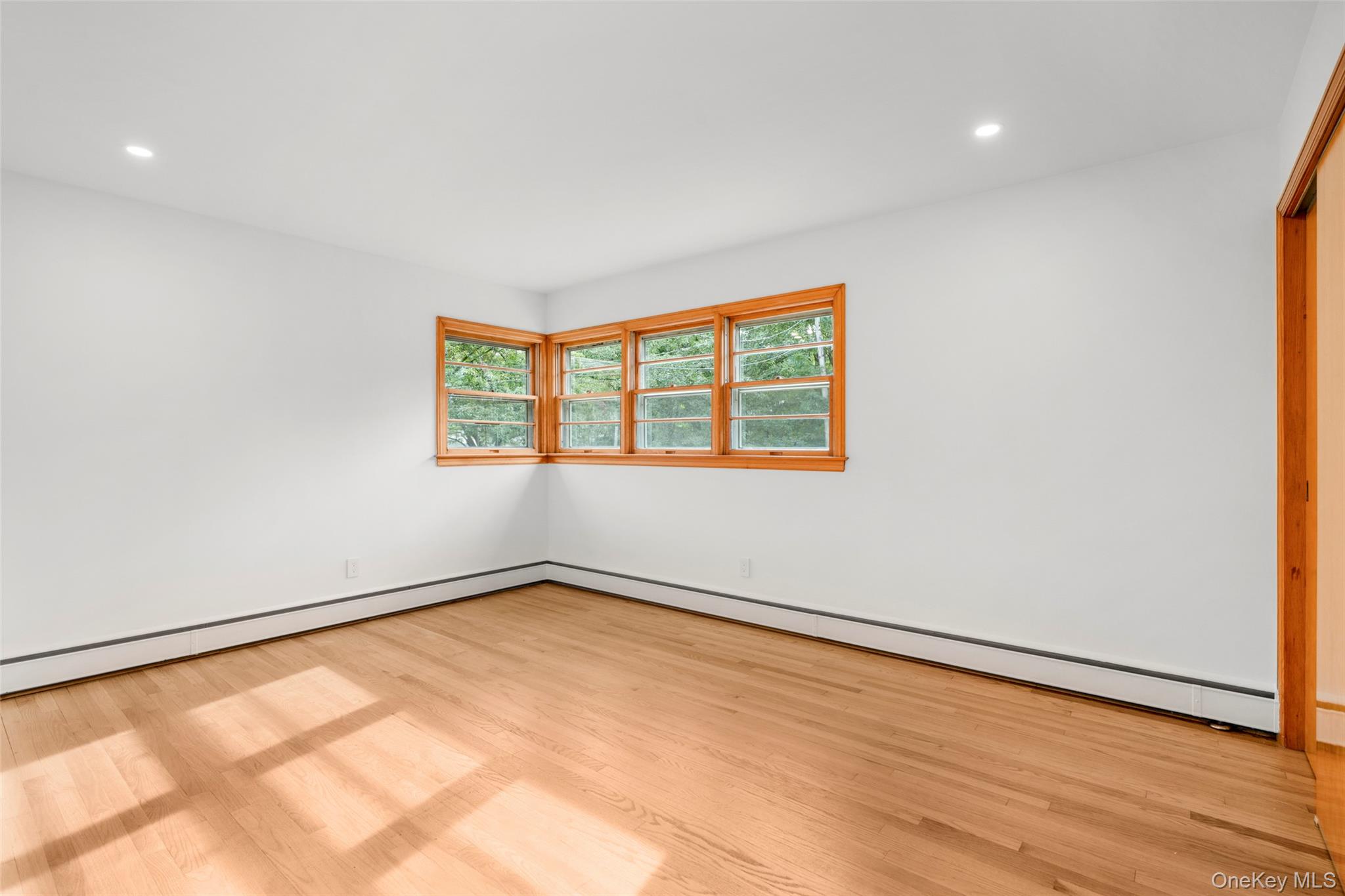 1 Craigside Drive Cold Spring, NY 10516 - Photo 18 of 36 Mid-century corner window and pristine oak floors in primary bedroom