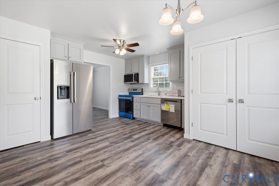 6019 Otterdam Road Waverly, VA 23890 - Photo 12 of 26 Kitchen featuring wood-finish flooring, stainless