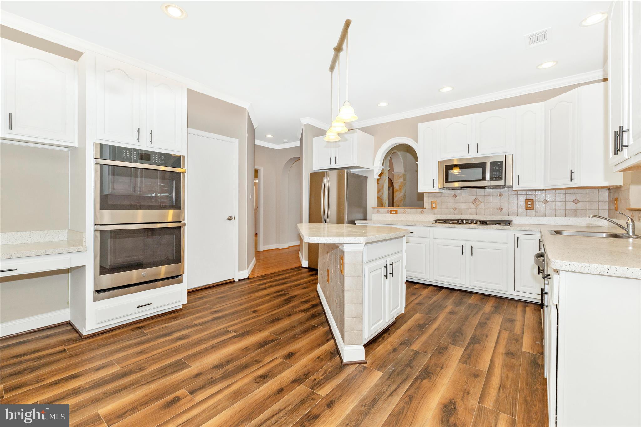 2654 Brook Valley Road Frederick, MD 21701 - Photo 14 of 64 a kitchen with granite countertop a sink cabinets and stainless steel appliances