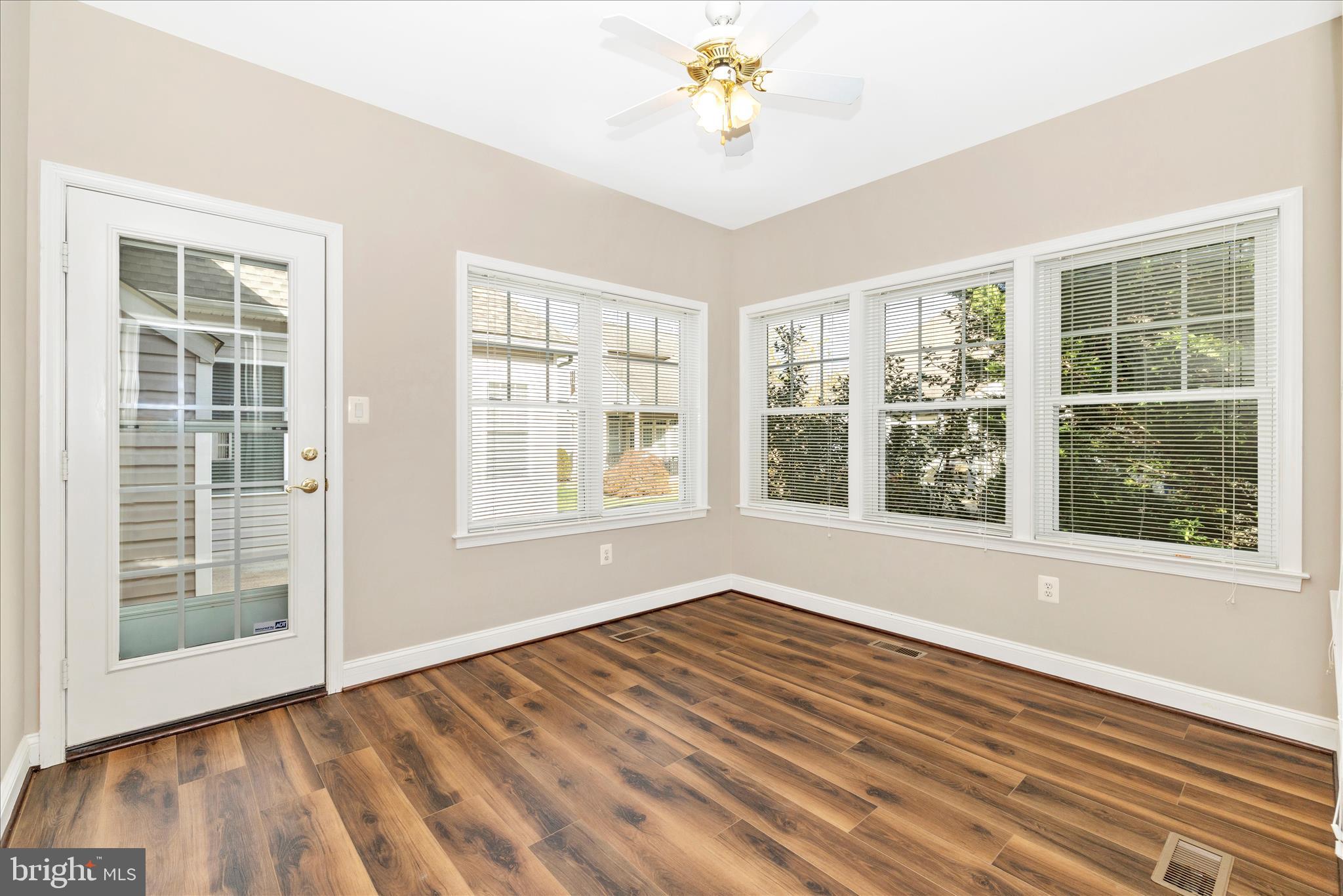 2654 Brook Valley Road Frederick, MD 21701 - Photo 19 of 64 an empty room with wooden floor and windows
