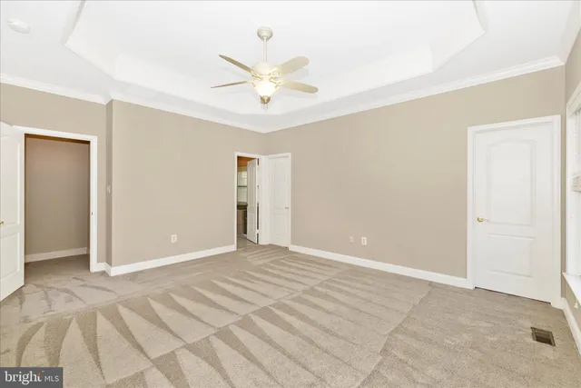 a spacious bathroom with a sink a toilet a mirror and a bathtub
