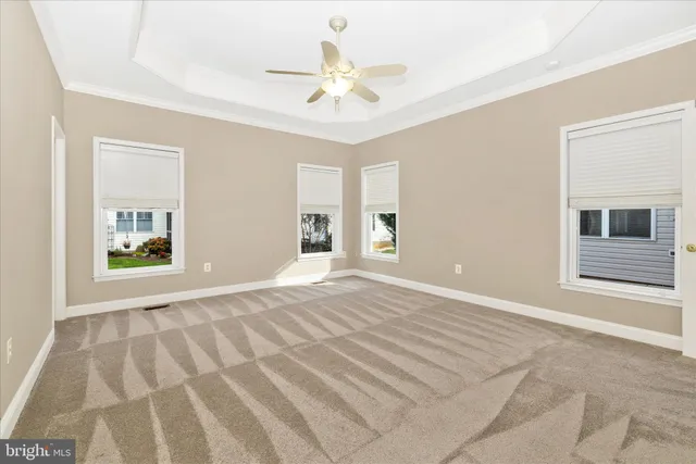 a room with a window and a chair