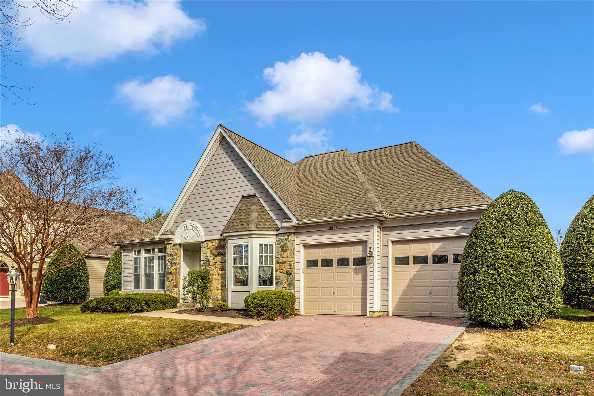 2654 Brook Valley Road Frederick, MD 21701 - Photo 44 of 64 a view of a white house next to a yard with big trees