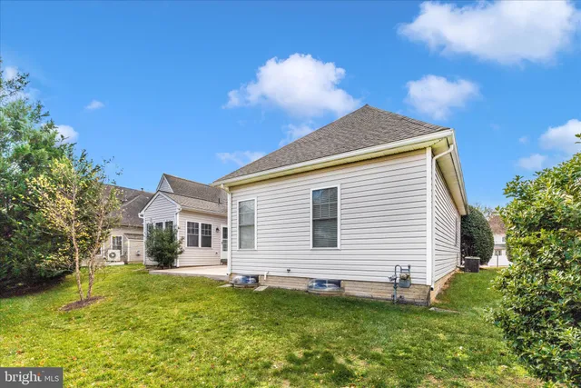 a view of swimming pool with outdoor seating and plants