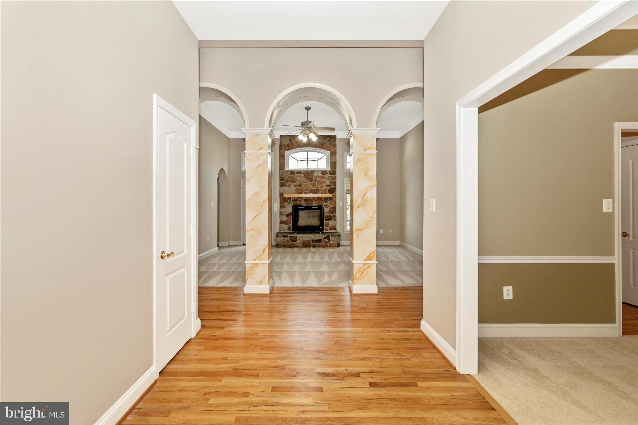 2654 Brook Valley Road Frederick, MD 21701 - Photo 5 of 64 a view of a hallway with wooden floor and a living room