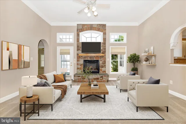 a view of an empty room with window and fire place
