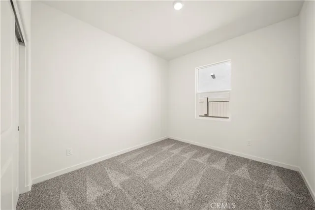 a bathroom with a granite countertop sink a toilet and bathtub