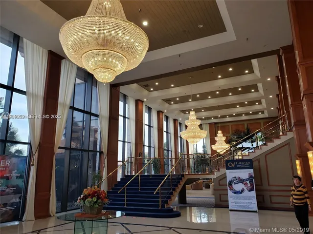 a large room with lots of furniture and a painting