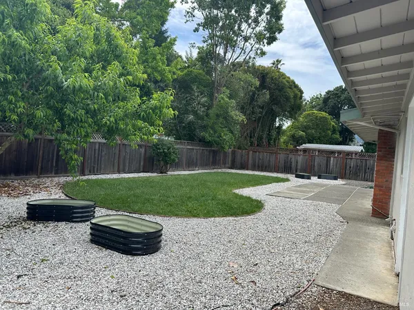 a view of garden with patio
