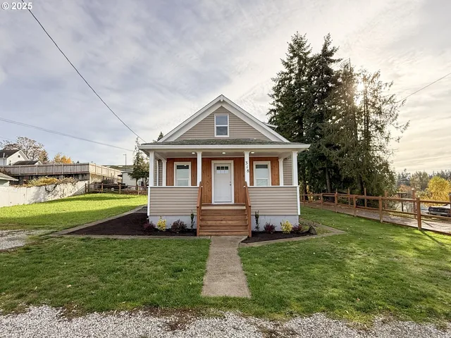 a front view of a house with garden
