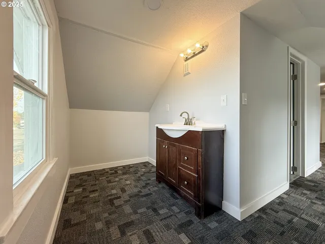 a bathroom with a sink vanity and a mirror