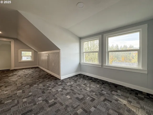 a spacious bathroom with a tub sink shower and a mirror