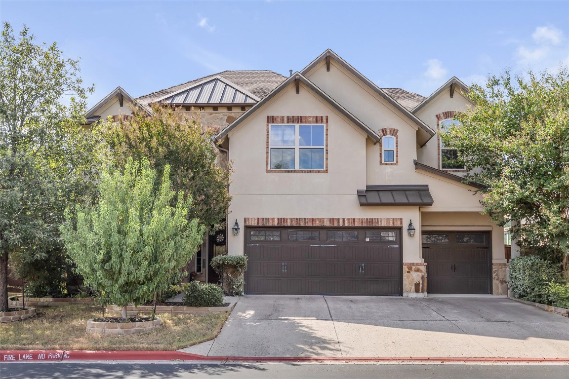 103 County Road 180, Unit 23 Leander, TX 78641 - Photo 1 of 40 a front view of a house with garage