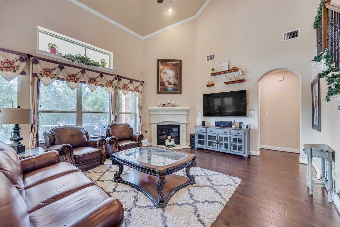 103 County Road 180, Unit 23 Leander, TX 78641 - Photo 14 of 40 a living room with furniture a flat screen tv and a fireplace
