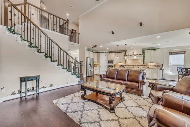 a living room with furniture fireplace and flat screen tv
