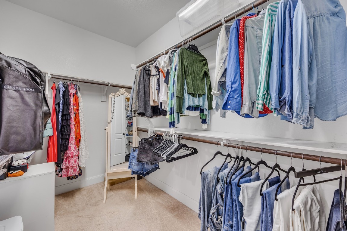 103 County Road 180, Unit 23 Leander, TX 78641 - Photo 22 of 40 a view of walk in closet with clothes and shoes