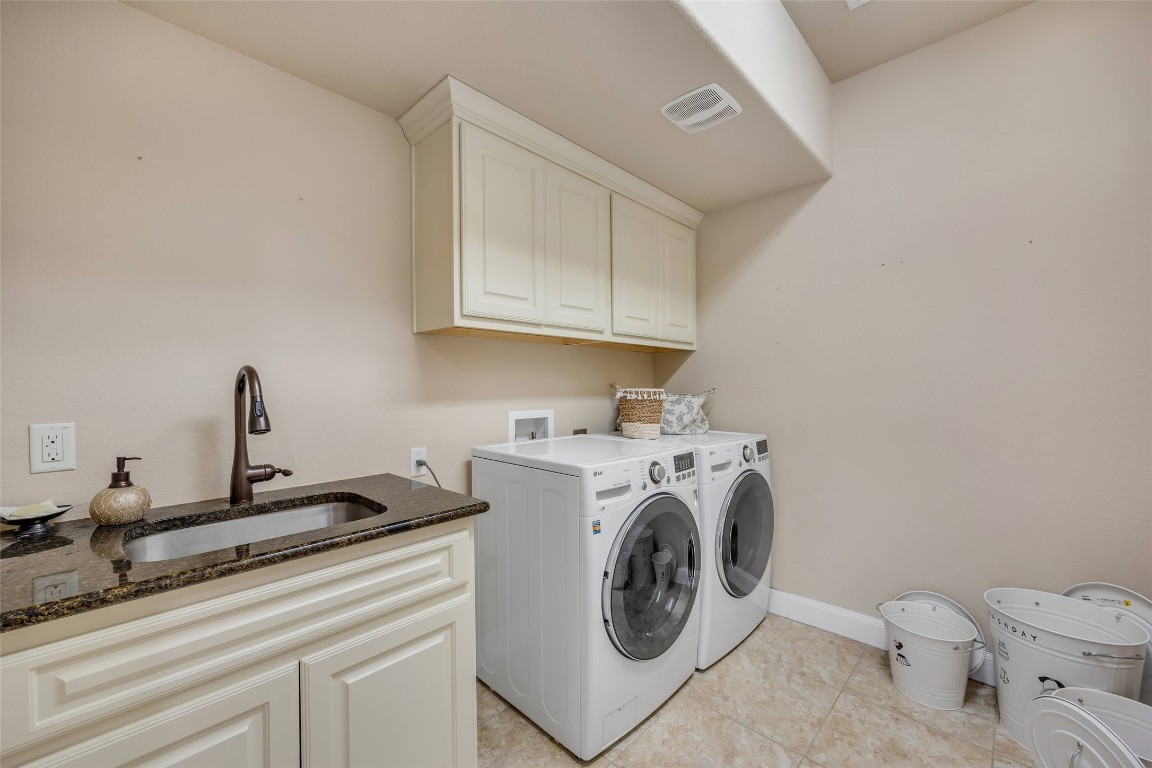 103 County Road 180, Unit 23 Leander, TX 78641 - Photo 23 of 40 a utility room with dryer and washer
