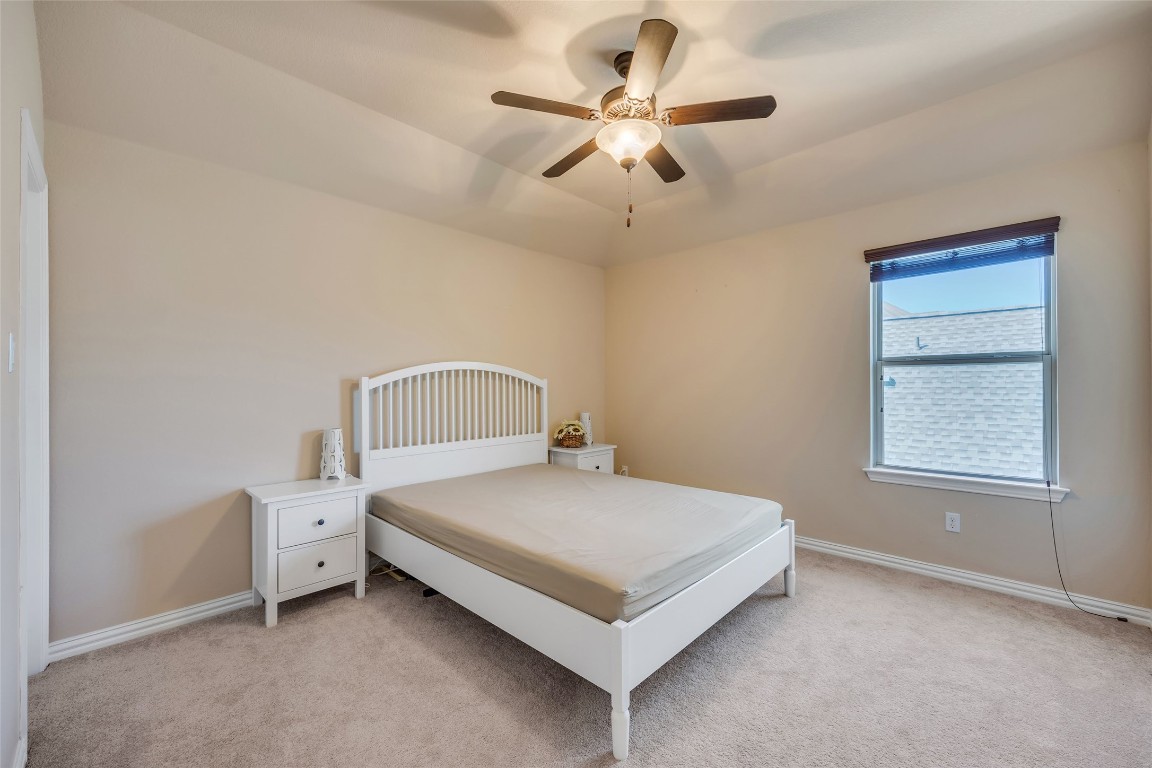 103 County Road 180, Unit 23 Leander, TX 78641 - Photo 26 of 40 a bedroom with a bed and a window