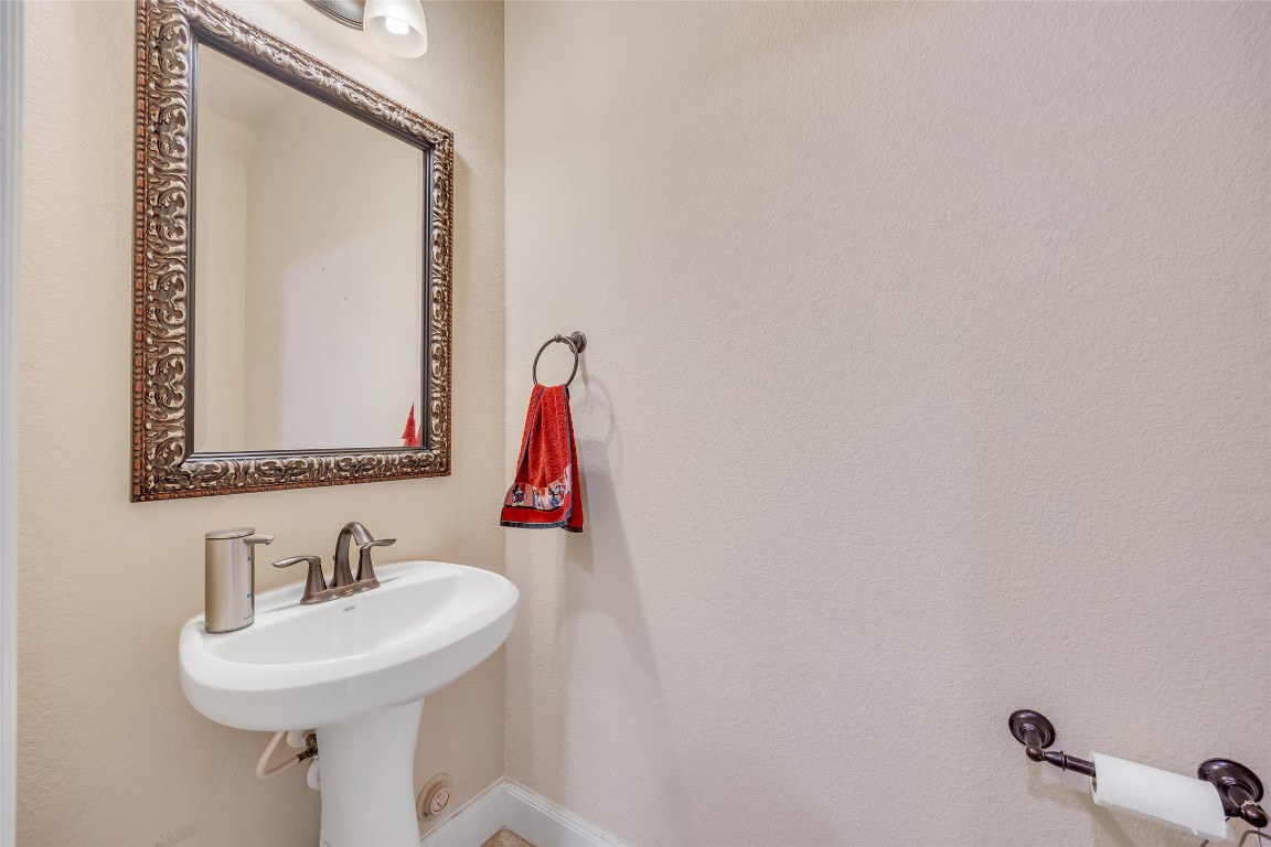 103 County Road 180, Unit 23 Leander, TX 78641 - Photo 3 of 40 a bathroom with a sink and a mirror