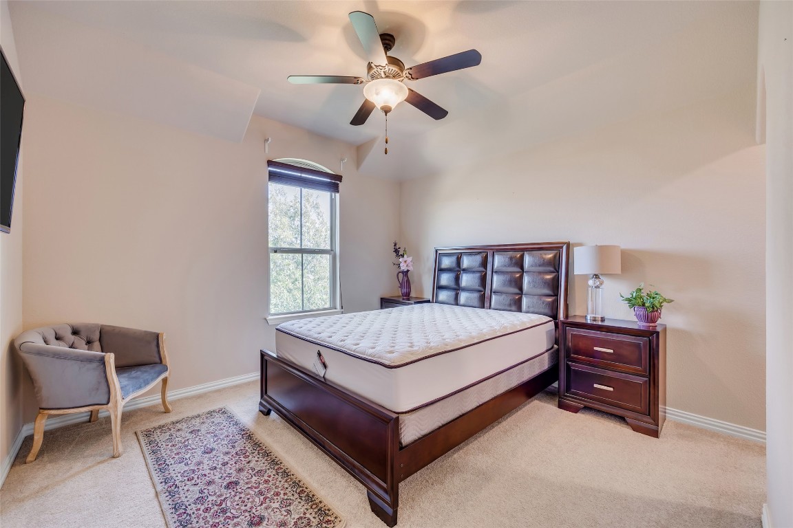 103 County Road 180, Unit 23 Leander, TX 78641 - Photo 34 of 40 a bedroom with a bed and window