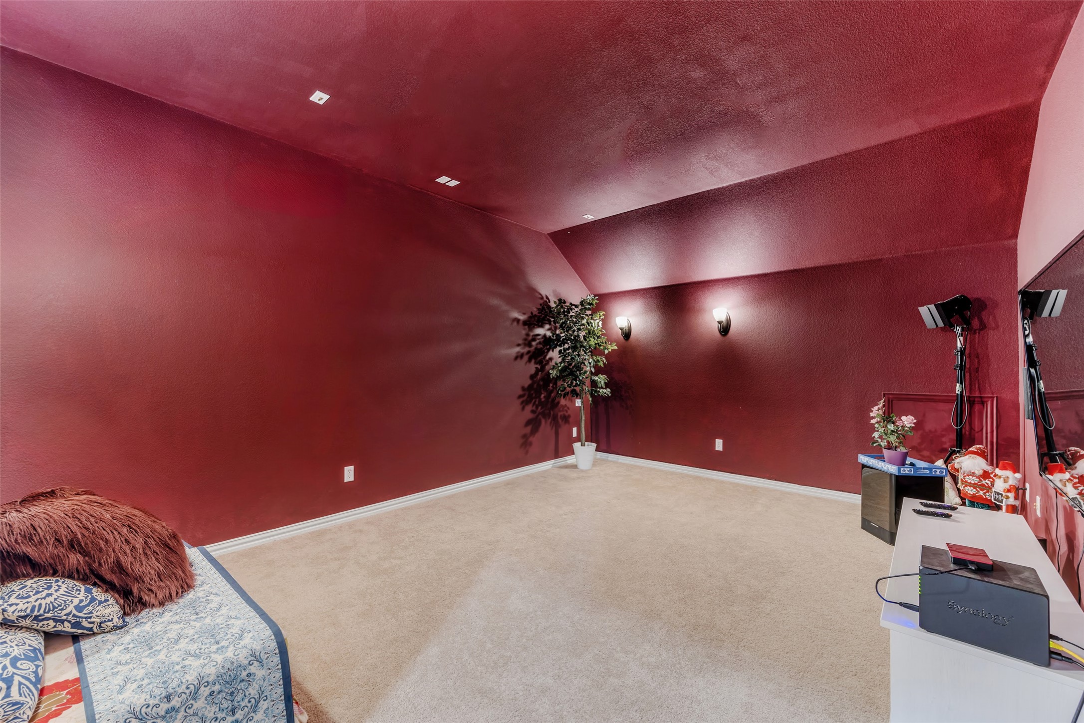 103 County Road 180, Unit 23 Leander, TX 78641 - Photo 36 of 40 Carpeted home theater with vaulted ceiling and a textured ceiling