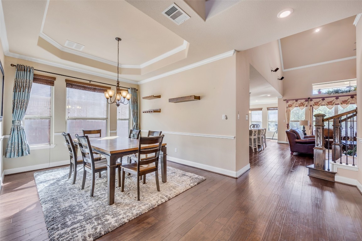 103 County Road 180, Unit 23 Leander, TX 78641 - Photo 6 of 40 a view of a dining room with furniture and wooden floor
