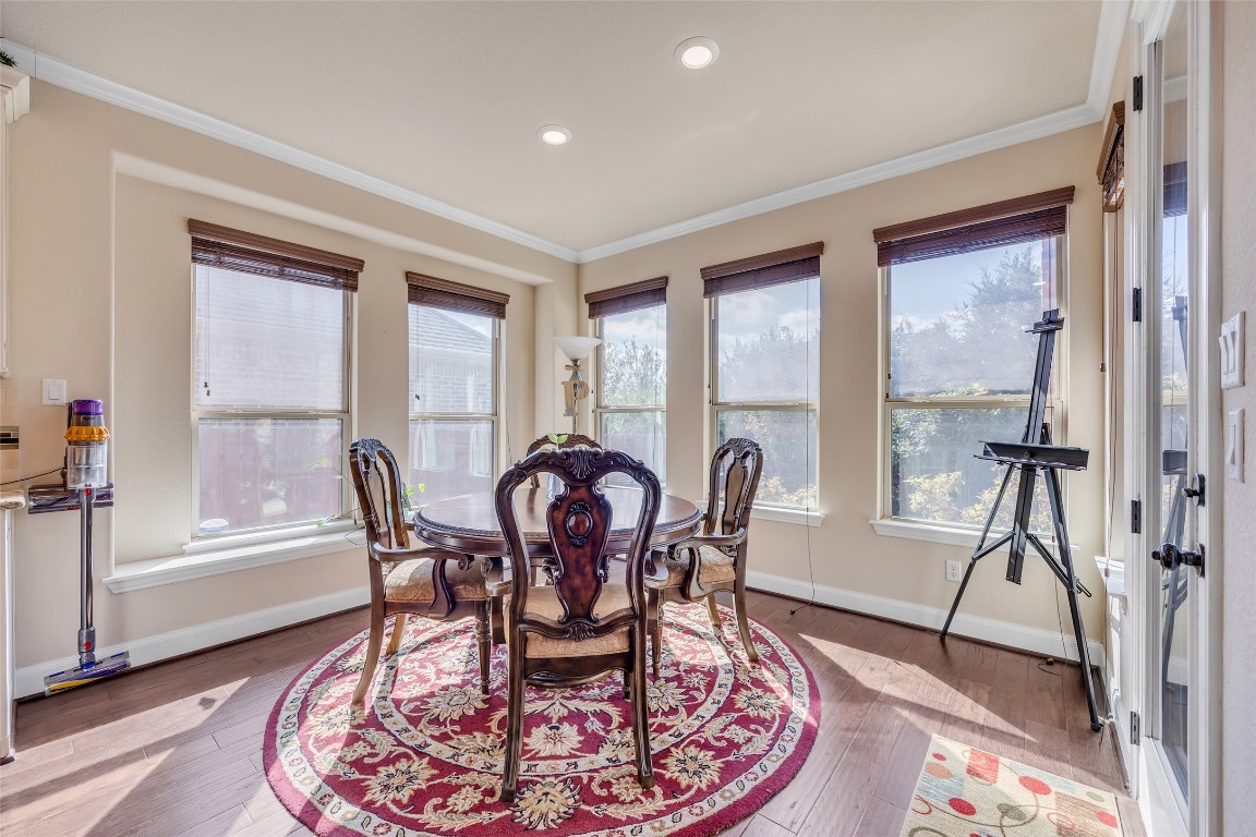 103 County Road 180, Unit 23 Leander, TX 78641 - Photo 10 of 40 a view of a dining room with furniture window and wooden floor