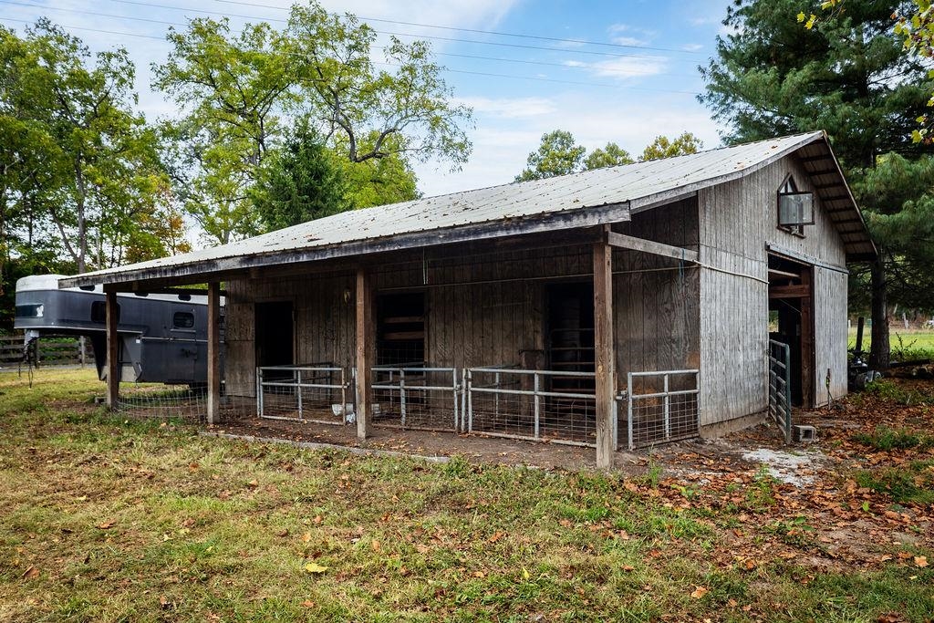 8787 Thorny Branch Road Bridgewater, VA 22812 - Photo 14 of 46 a backyard of a house with large trees and wooden fence