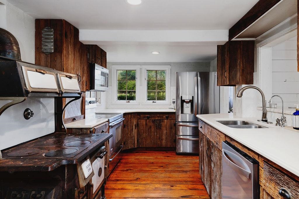 8787 Thorny Branch Road Bridgewater, VA 22812 - Photo 16 of 46 a kitchen with stainless steel appliances granite countertop a sink stove and refrigerator