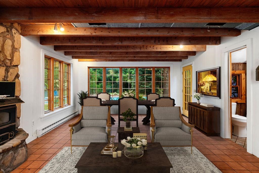 8787 Thorny Branch Road Bridgewater, VA 22812 - Photo 23 of 46 a living room with furniture and a floor to ceiling window