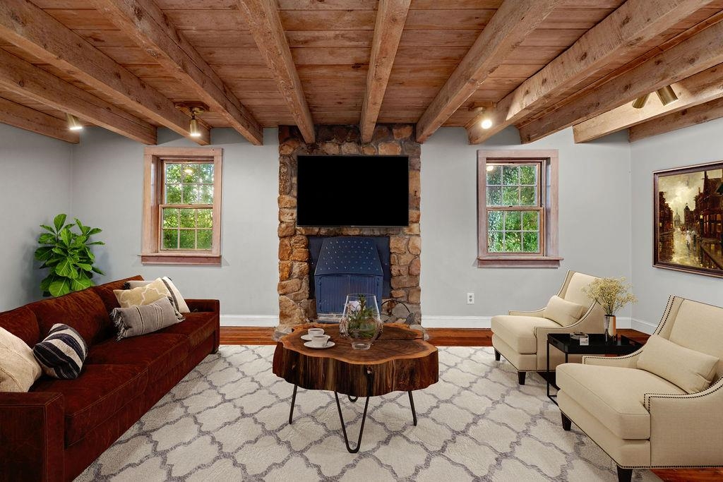 8787 Thorny Branch Road Bridgewater, VA 22812 - Photo 32 of 46 a living room with furniture a flat screen tv and a fireplace