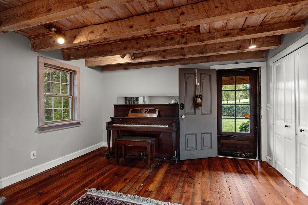 8787 Thorny Branch Road Bridgewater, VA 22812 - Photo 35 of 46 a view of a livingroom with wooden floor a piano and windows
