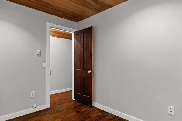 a bathroom with a granite countertop toilet a sink and a shower