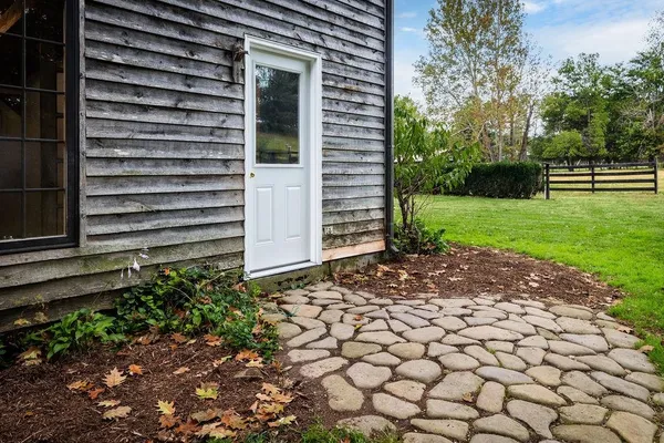 a front view of house with yard and green space