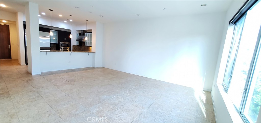 21 Gramercy, Unit 307 Irvine, CA 92612 - Photo 13 of 65 a view of kitchen with refrigerator and window