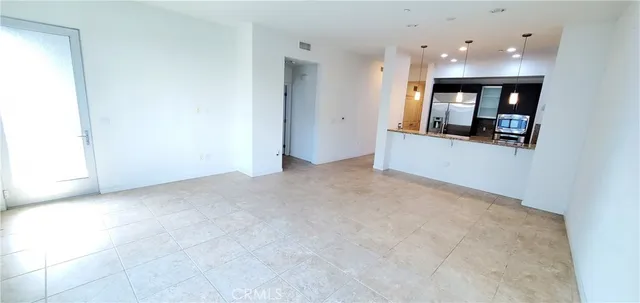 a kitchen with granite countertop a sink and a stove top oven