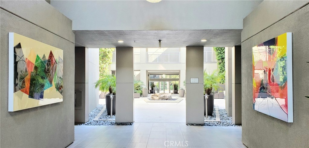 21 Gramercy, Unit 307 Irvine, CA 92612 - Photo 2 of 65 a view of hallway with furniture and large windows