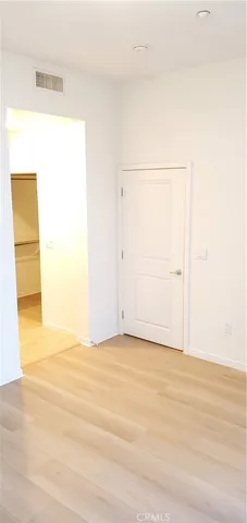 a white toilet sitting next to a bath tub