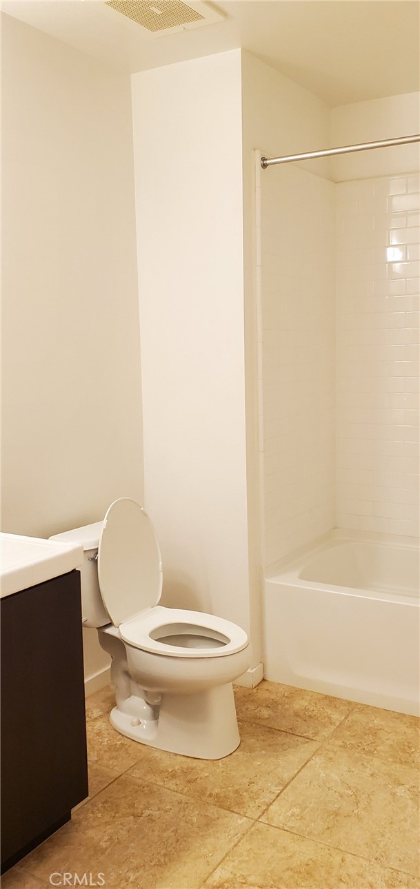 21 Gramercy, Unit 307 Irvine, CA 92612 - Photo 33 of 65 a white toilet sitting next to a bath tub