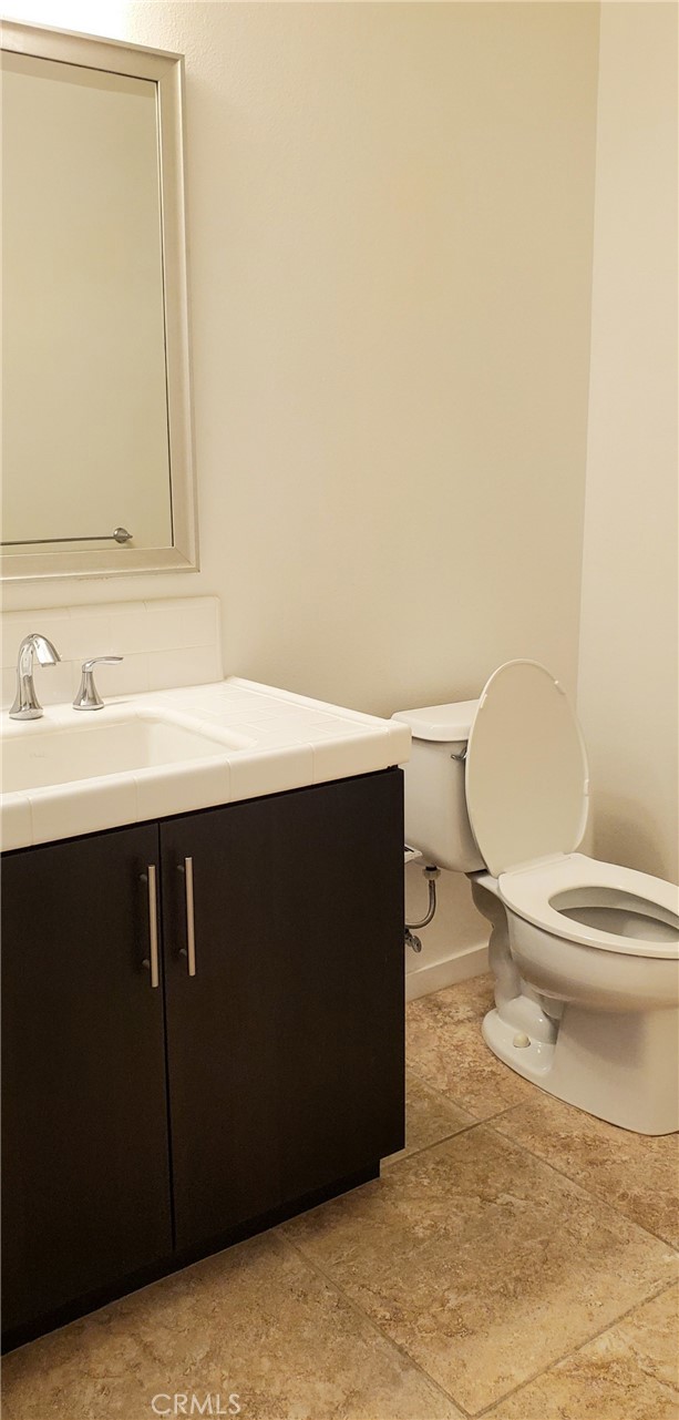 21 Gramercy, Unit 307 Irvine, CA 92612 - Photo 34 of 65 a bathroom with a sink and a toilet